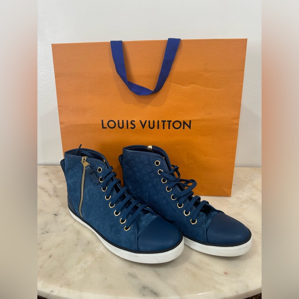 Louis Vuitton limited-edition blue suede embossed high top sneakers.